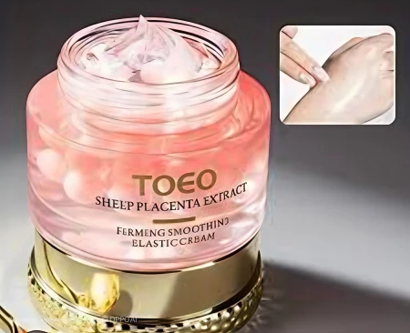 TOEO Sheep Placenta Extract Elastic Cream z kapsułkami odżywczymi rozpuszczającymi się podczas aplikacji na skórę.